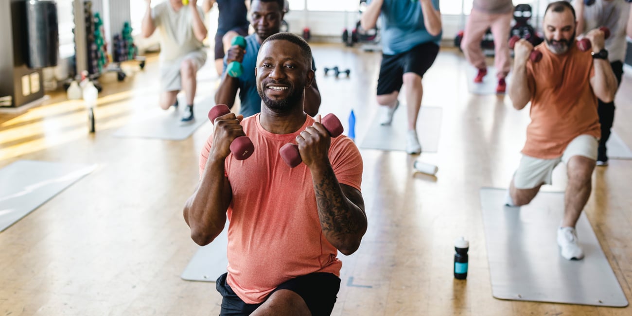 Man smiling while working out